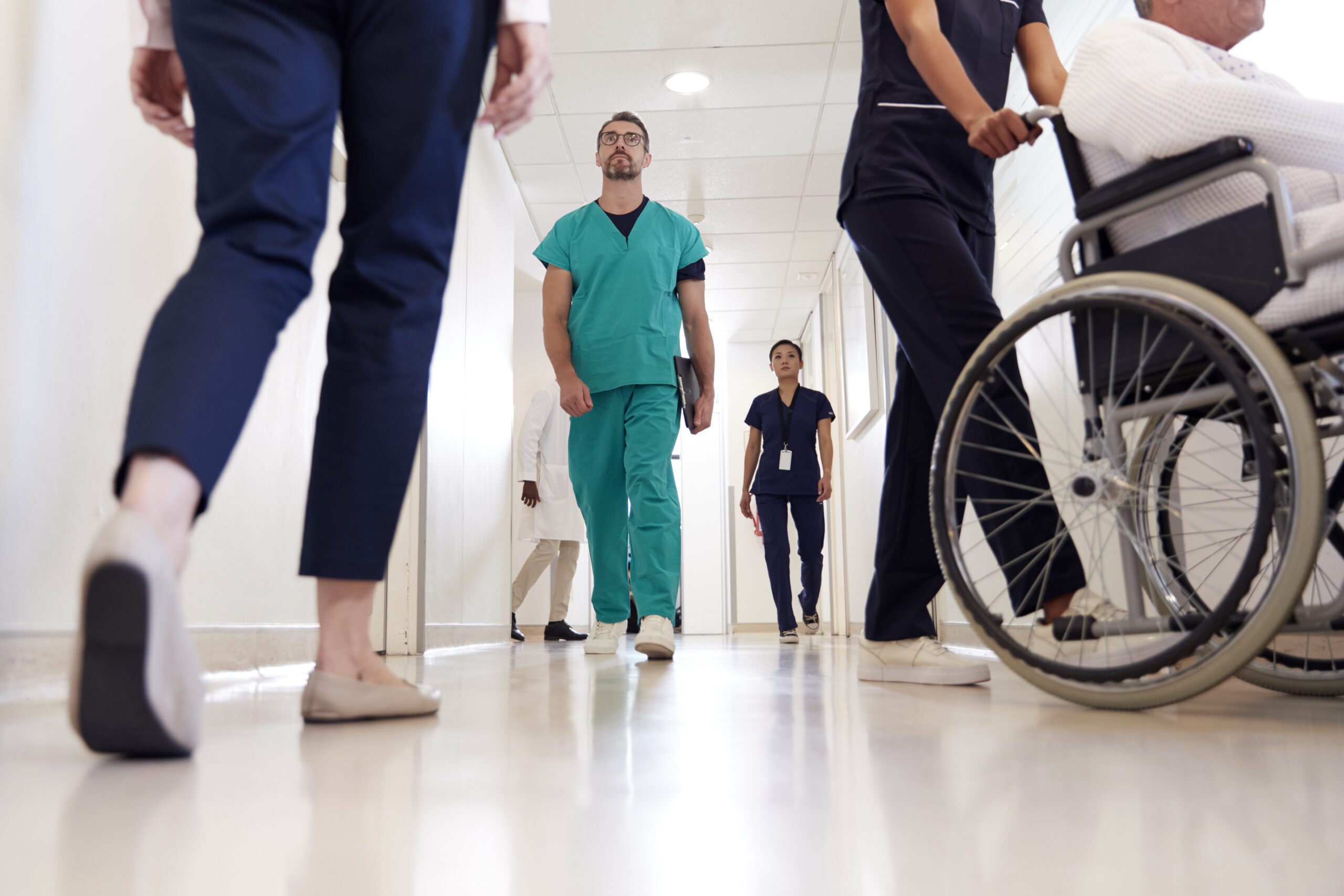 Busy Hospital Corridor With Medical Staff And Patients