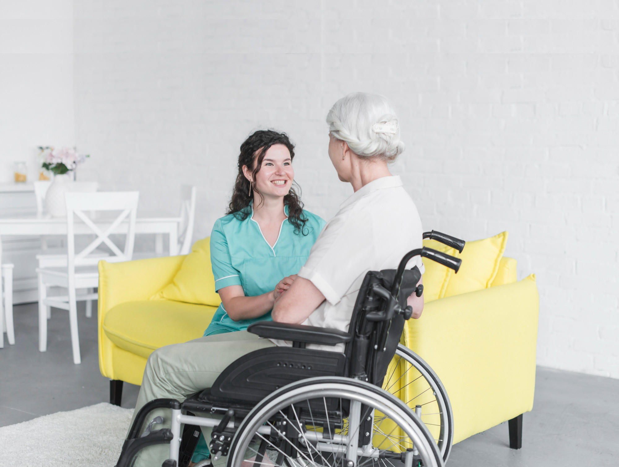Female caregiver with elderly woman