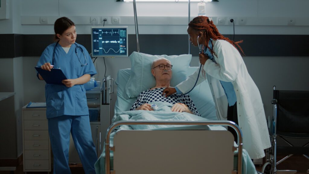 A senior man receiving care in the hospital