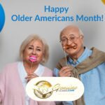 Two senior citizens holding balloons and party masks over their faces. Photo text says happy older americans month, and has the Genuine Global Care logo
